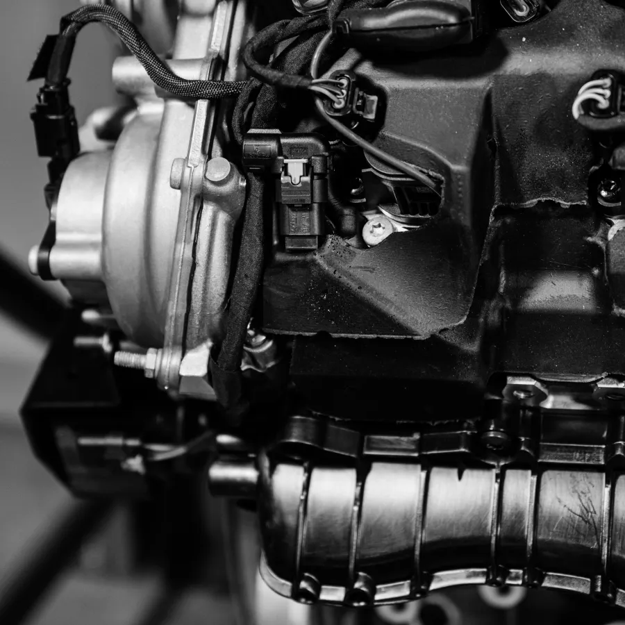 Close-up of a factory-new engine's black internal components
